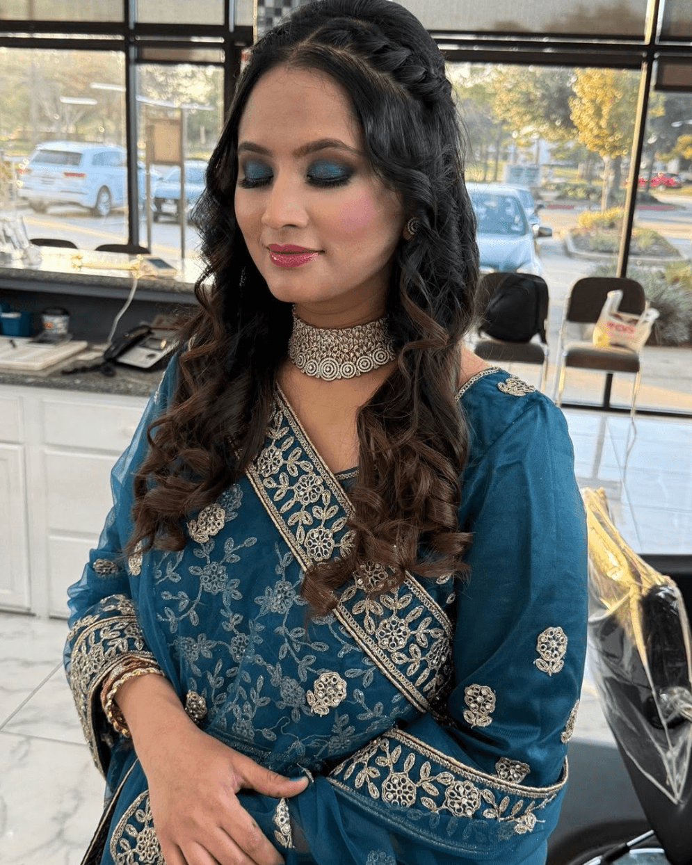 Beautiful bridal makeup with elegant blue traditional dress